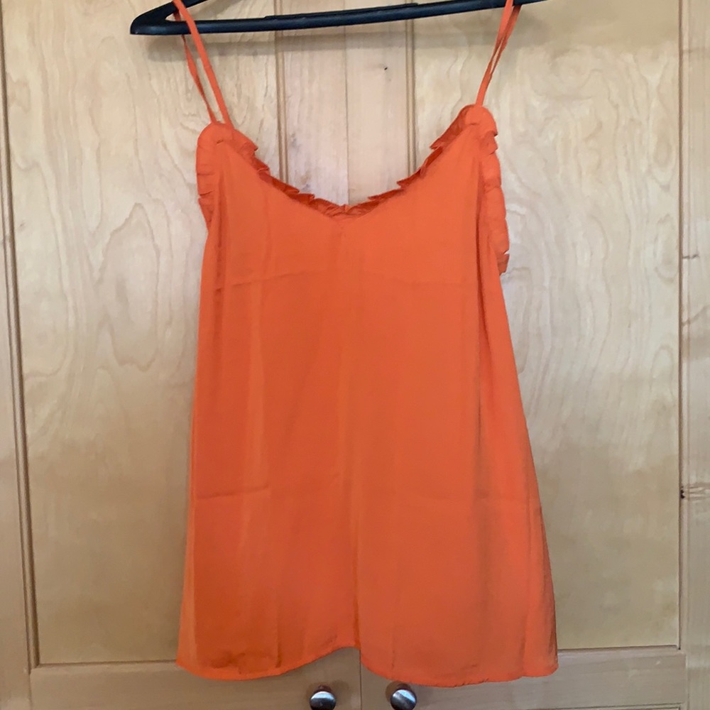 Orange tank top.